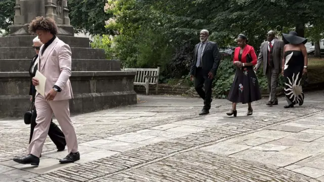 The family of Syd Lawrence arriving at the church in Bristol.