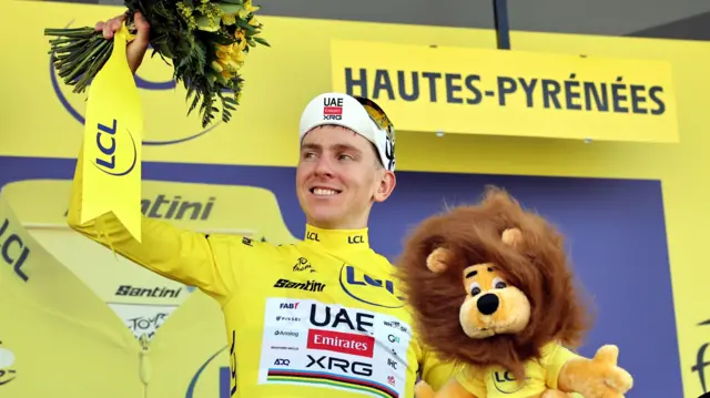 Tadej Pogacar on the podium after winning on stage 12 of the 2025 Tour de France