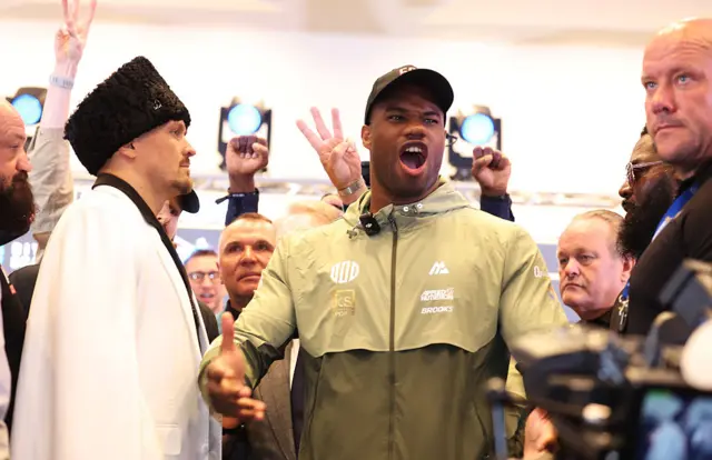 Daniel Dubois shouting next to Oleksandr Usyk