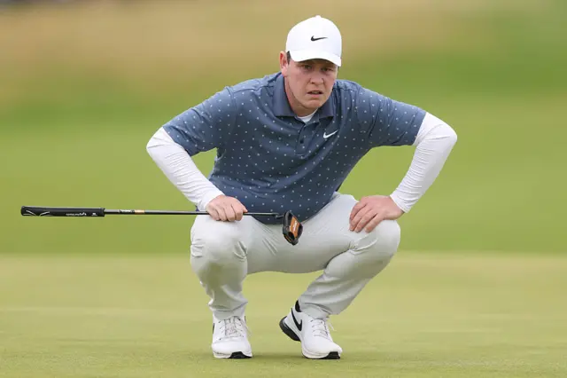Bob MacIntyre scours the green