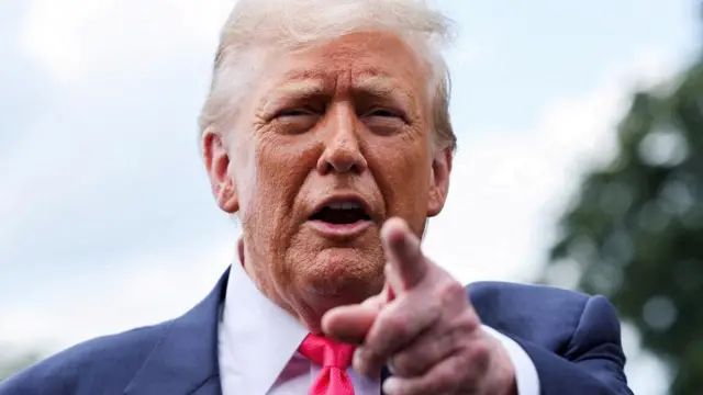 Close up of Donald Trump pointing at the camera