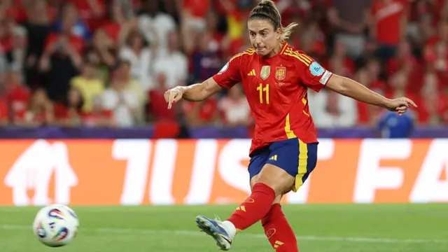 Alexia Putellas of Spain takes a penalty kick which is saved by Livia Peng of Switzerland