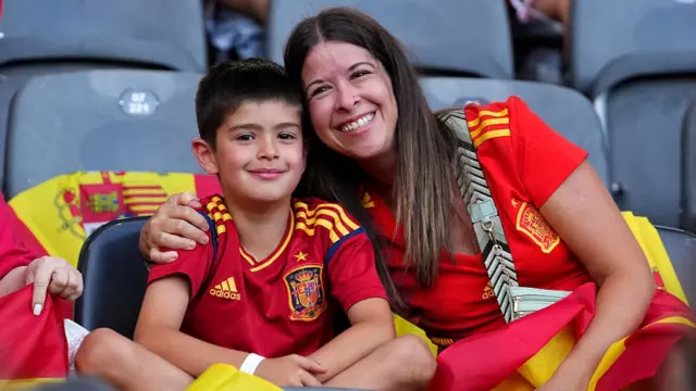 Fans of Spain pose for a photo as they enjoy the pre-match atmosphere