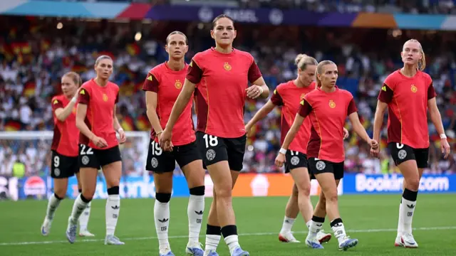 Giovanna Hoffmann of Germany looks on, as she warms up with her teammates