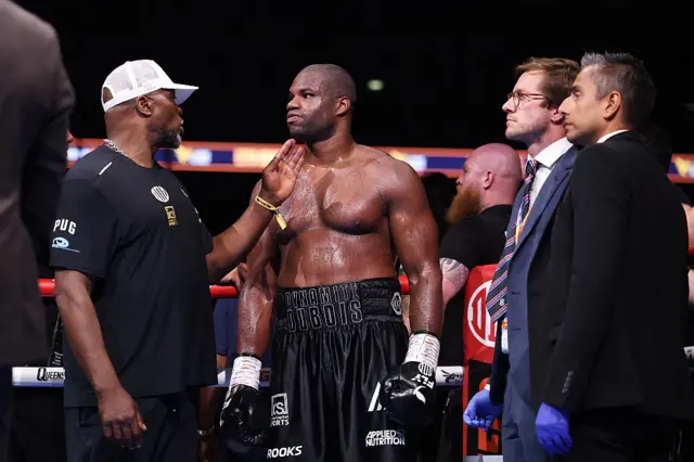 Daniel Dubois is consoled by his father