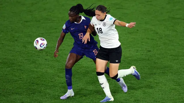 Griedge Mbock Bathy of France battles for possession with Giovanna Hoffmann of Germany