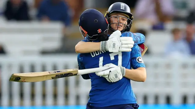 England's Sophia Dunkley and Tammy Beaumont celebrate after the match