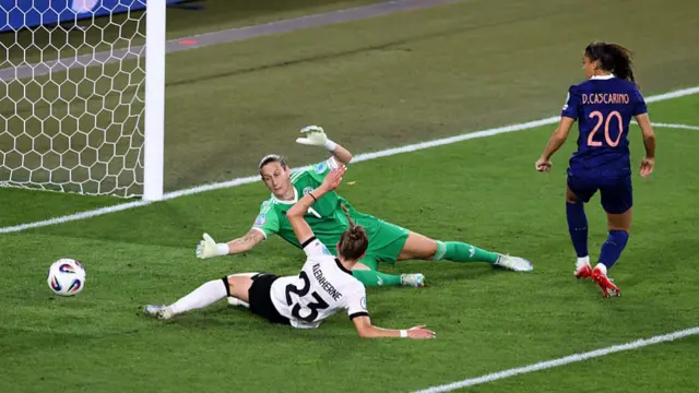Delphine Cascarino of France scores her sides goal past Ann-Katrin Berger of Germany which is later ruled offside
