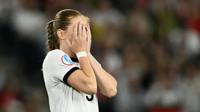 Germany's midfielder #09 Sjoeke Nuesken reacts after missing a penalty