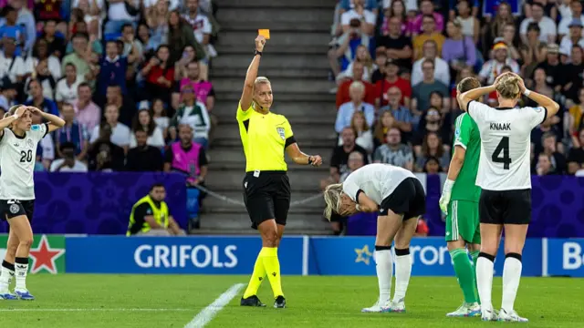 Referee Tess Olofsson shows a red card for Kathrin Hendrich of Germany