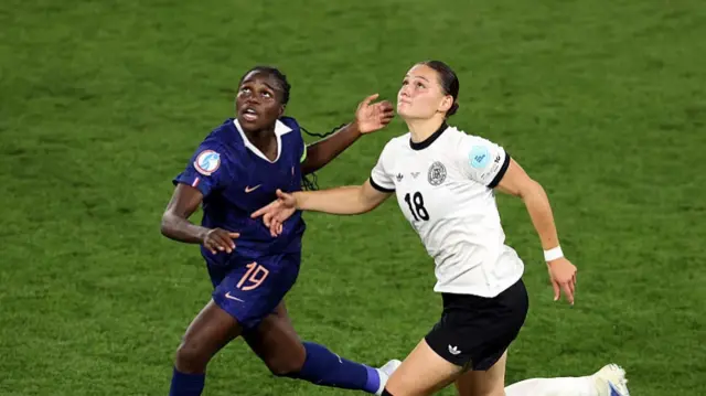 Griedge Mbock Bathy of France battles for possession with Giovanna Hoffmann of Germany