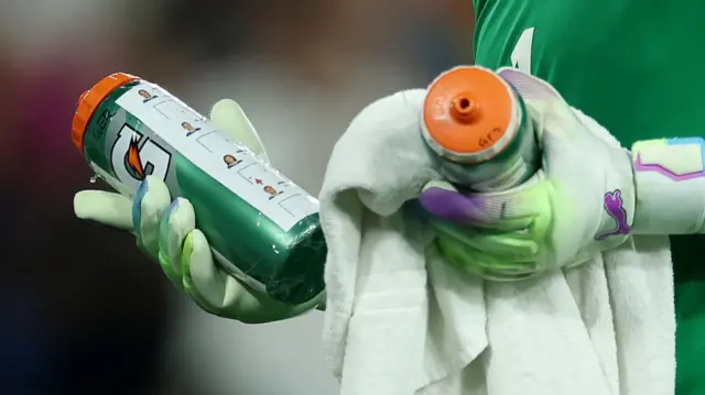 A detailed view of the water bottle of Ann-Katrin Berger of Germany including Amel Majri, Clara Mateo, Delphine Cascarino and Alice Sombath, penalty takers of France