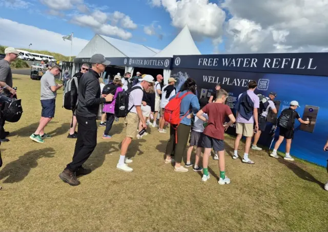 People refilling water bottles