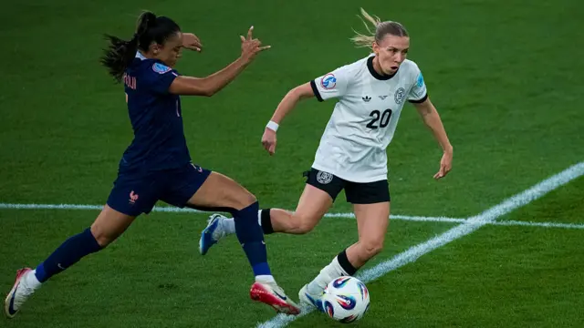 Elisa Senss of Germany (R) dribbles against Sakina Karchaoui of France (L)
