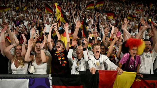 Germany's supporters celebrate after Germany's victory