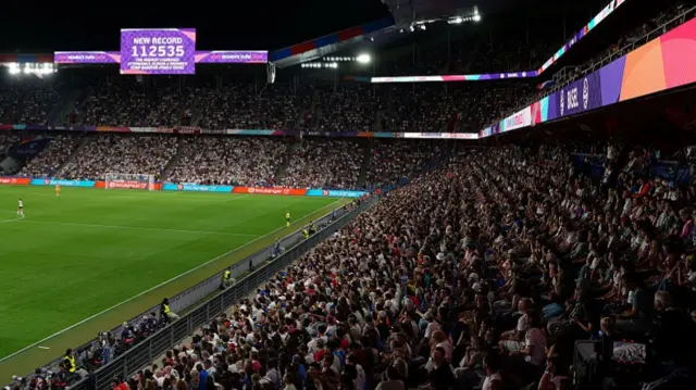 The LED screen reads "New Record, 112535, The Highest combined attendance across a women's EURO quarter-finals stage
