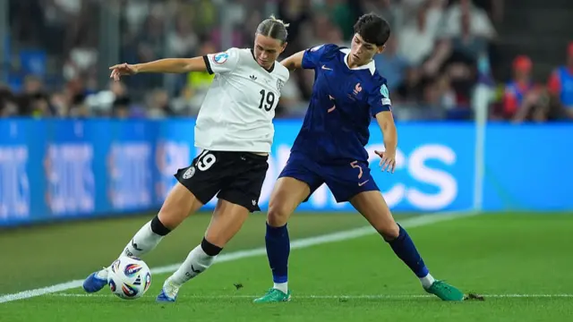 Klara Buhl of Germany (L) and Elisa De Almeida of France (R) compete for the ball