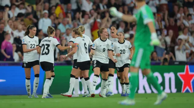 Germany's Sjoeke Nusken celebrates scoring their first goal with teammates