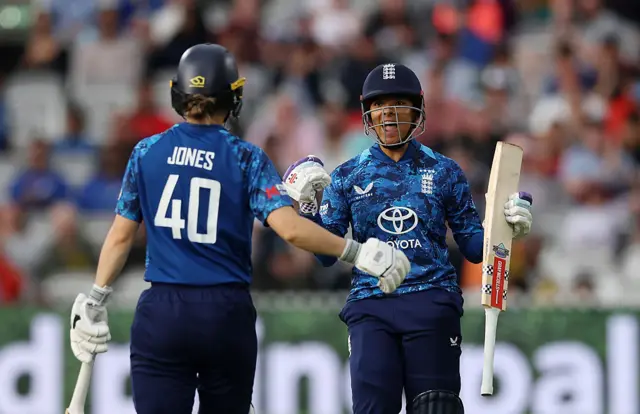 England's Sophia Dunkley and Amy Jones celebrate victory over India after the former hits the winning runs