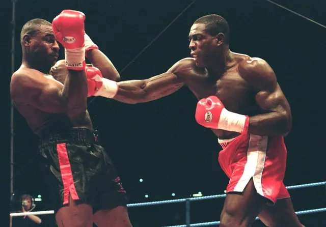 Frank Bruno of Great Britain hits Oliver McCall of the USA
