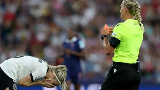 Kathrin Hendrich of Germany reacts after being shown a red card from referee Tess Olofsson