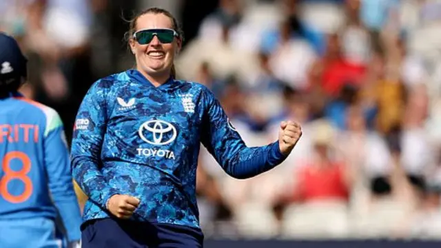 Sophie Ecclestone of England celebrates taking the wicket of Richa Ghosh