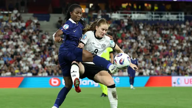 Sjoeke Nuesken of Germany is challenged by Oriane Jean-Francois of France