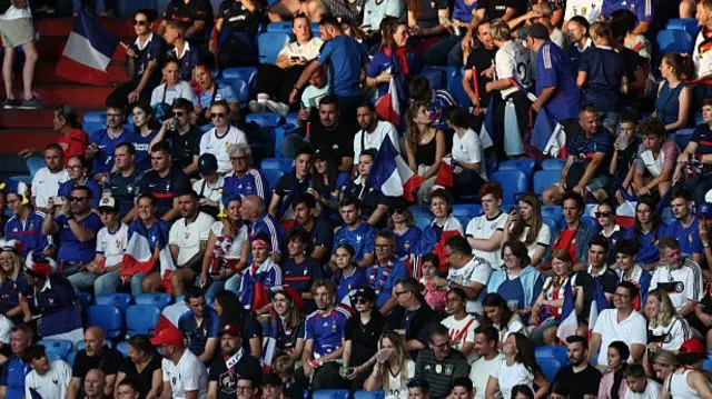Fans of France waving their national flag