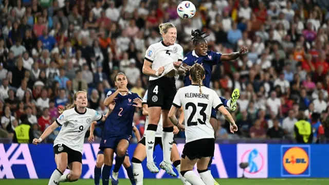 Germany's defender #04 Rebecca Knaak (Top-L) and France's forward #09 Melvine Malard (Top-R) jump to head the ball