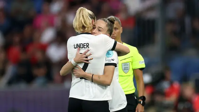 Sarai Linder of Germany interacts with Sophia Kleinherne of Germany after being substituted off following an injury