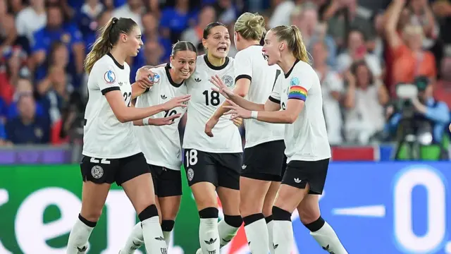 Players of Germany celebrate their team's first goal scored by Sjoeke Nusken of Germany