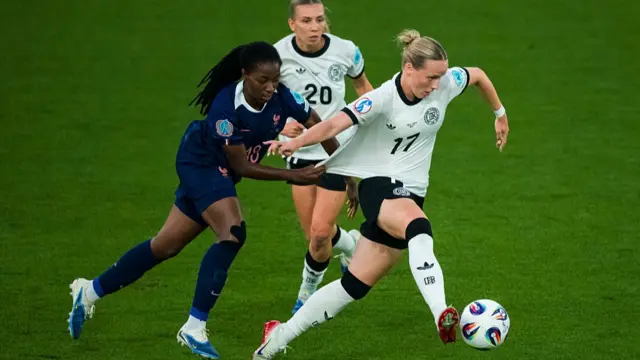 Oriane Jean-François of France (L) tackles Franziska Kett of Germany (R)