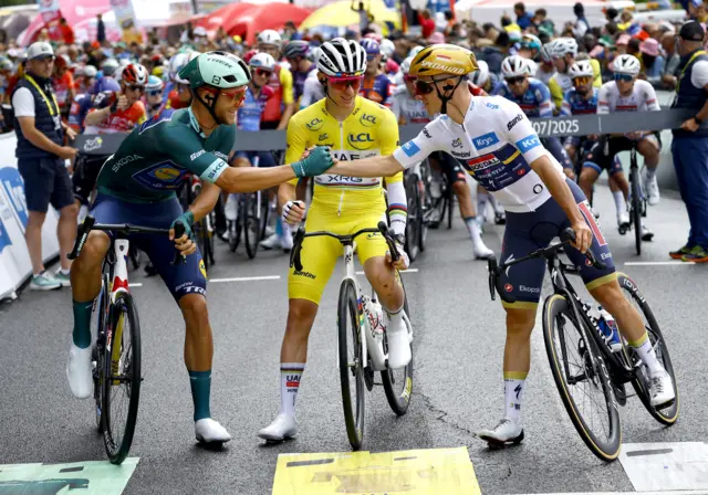 Jonathan Milan, Tadej Pogacar and Remco Evenepoel before the start of stage 14 of the 2024 Tour de France