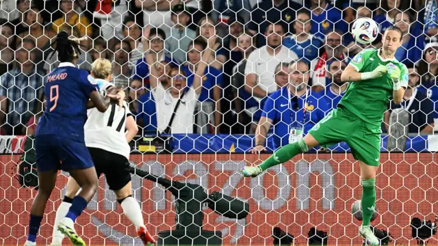 Germany's goalkeeper #01 Ann-Katrin Berger (R) stops a scoring opportunity