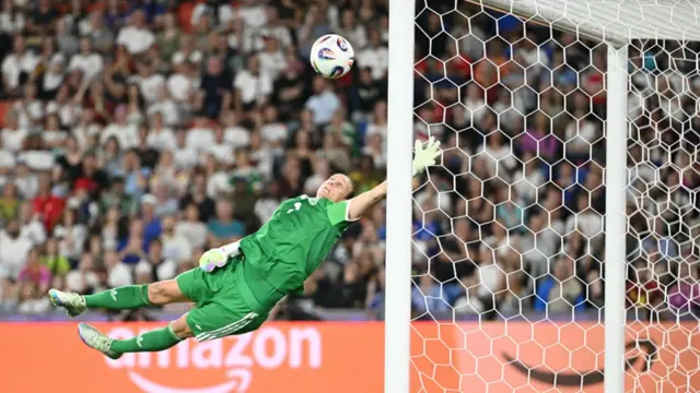 Germany's goalkeeper #01 Ann-Katrin Berger dives to stop the ball
