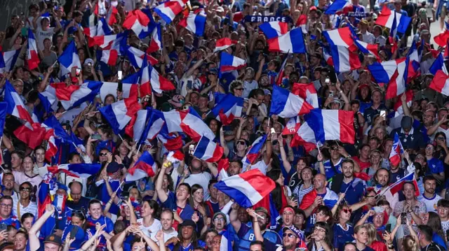 Fans of France arrive at the stadium