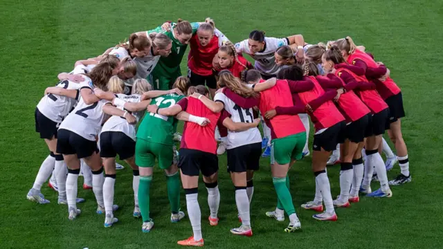 Players of Germany form a huddle