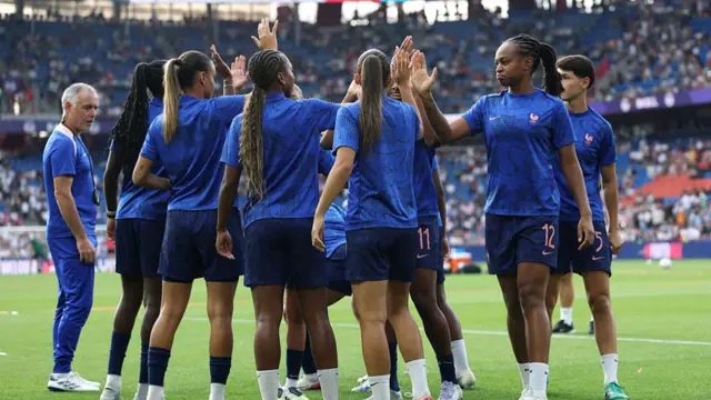 Marie-Antoinette Katoto and team mates of France interact