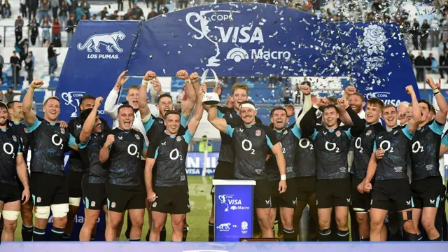England lift the trophy after beating Argentina 2-0