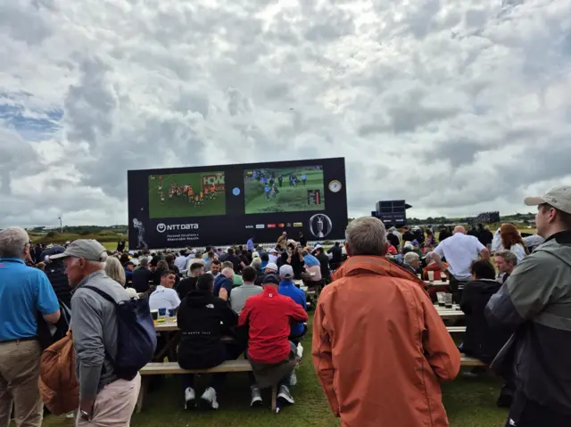 Fans watch the British and Irish Lions at the Open