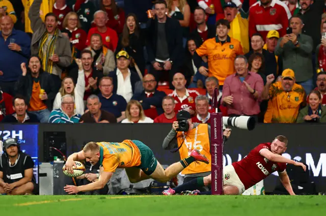 Max Jorgensen of the Wallabies scores a try