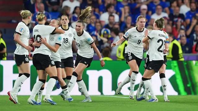 Sjoeke Nusken of Germany (2nd right) celebrates with teammates after scoring her team's first goal