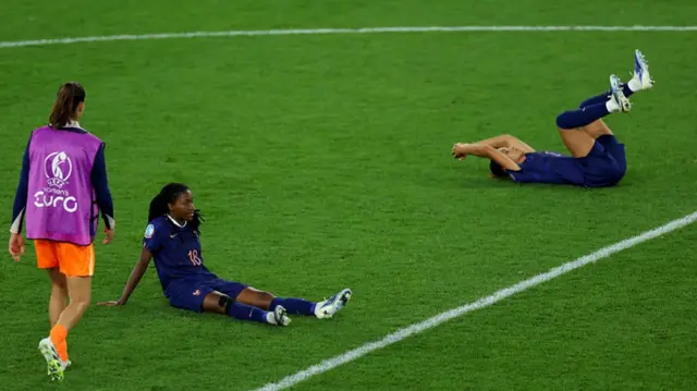 Oriane Jean-Francois of France looks dejected alongside her teammates after the teams defeat and elimination from the tournament