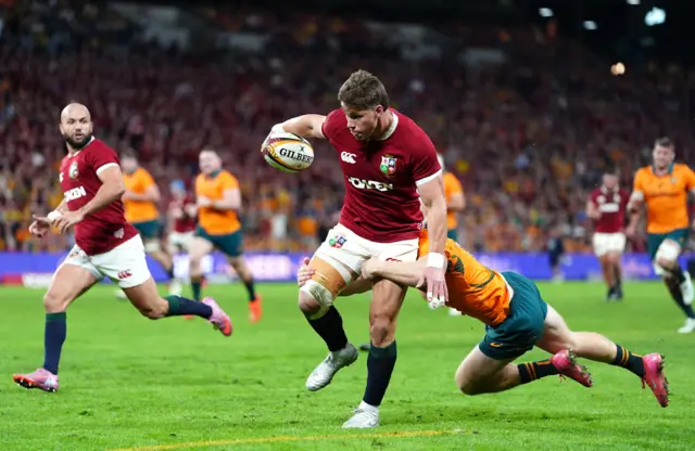 British and Irish Lions' Huw Jones is tackled
