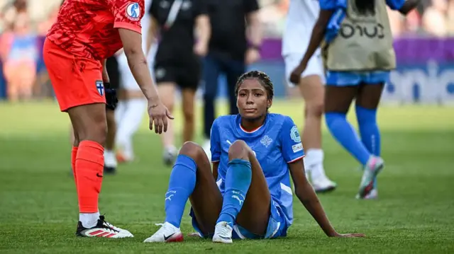Finland's goalkeeper #01 Anna Koivunen (L) reacts next to Iceland's forward #23 Sveindis Jane Jonsdottir at the end of the UEFA Women's Euro 2025 Group A football match between Iceland and Finland at the Arena Thun stadium in Thun on July 2, 2025.