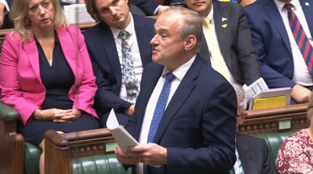 Ed Davey stands and speaks in the house of Commons