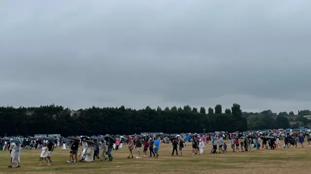 Spectators queue for Wimbledon on day three