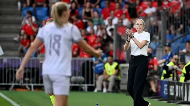 Norway's English head coach Gemma Grainger claps at the start of the UEFA Women's Euro 2025 Group A football match between Switzerland and Norway at the St Jakob-Park Stadium in Basel on July 2, 2025.
