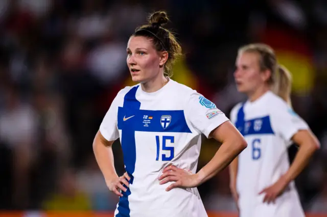 Natalia Kuikka with her hands on her hips for Finland