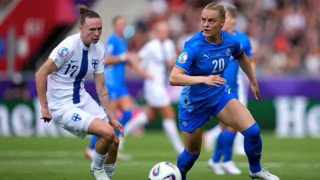Sanni Franssi of Finland runs with the ball under pressure from Gudny Arnadottir of Iceland during the UEFA Women's EURO 2025 Group A match between Iceland and Finland at Arena Thun